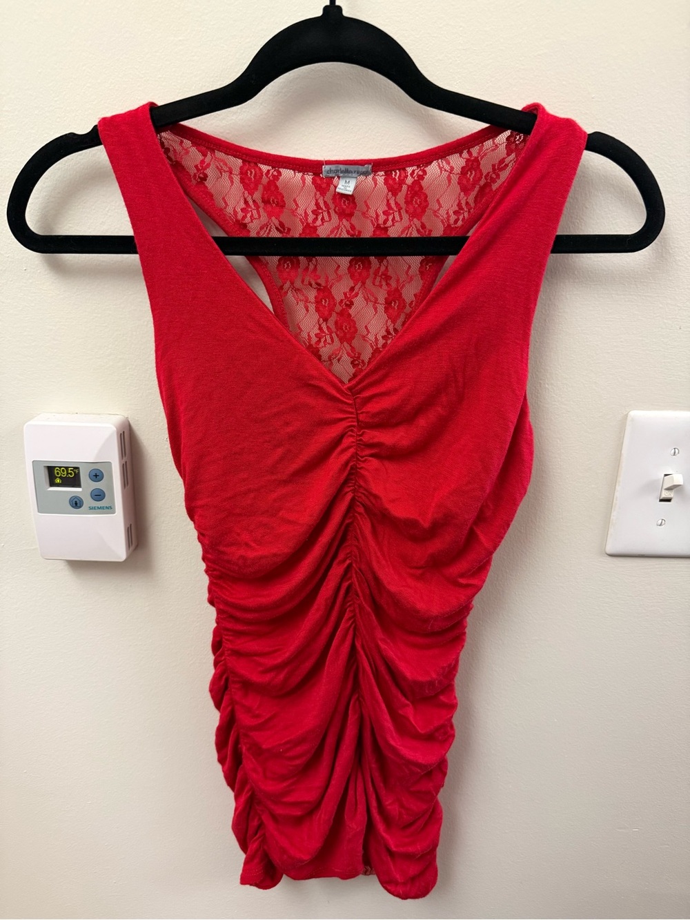 red top with ruffle seams in front and on the sides